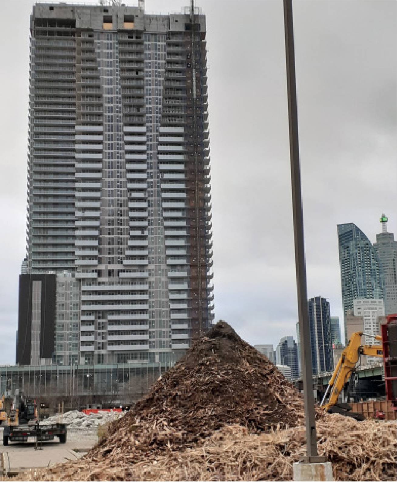 High rise with a rubble of wood chips